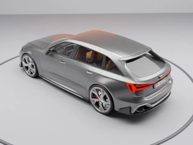Grey performance estate, rear three-quarter view on a soft studio floor, produced by Motuva Studio